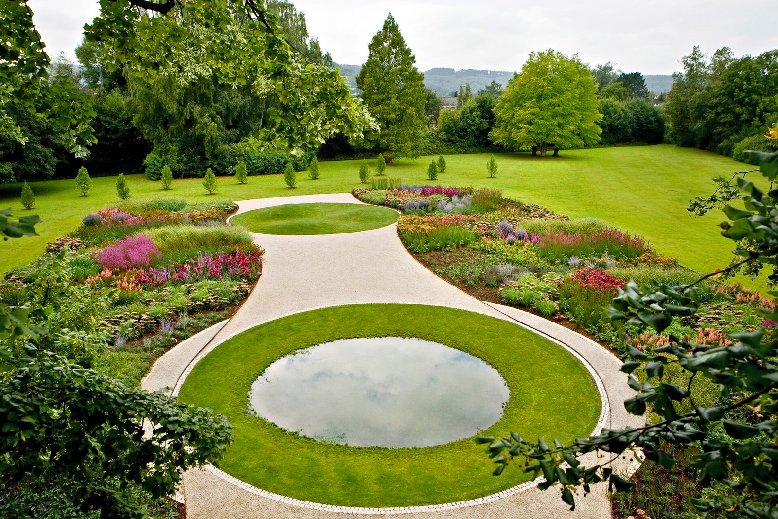 A sunny perennial garden with prairie-style flower beds in full bloom